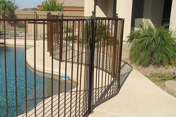 Wrought Iron Pool Safety Fence Following the Deck