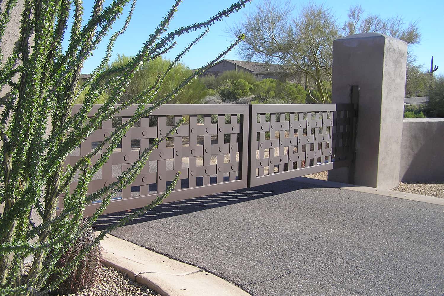 Side View of Decorative Driveway Gate with Basket Design