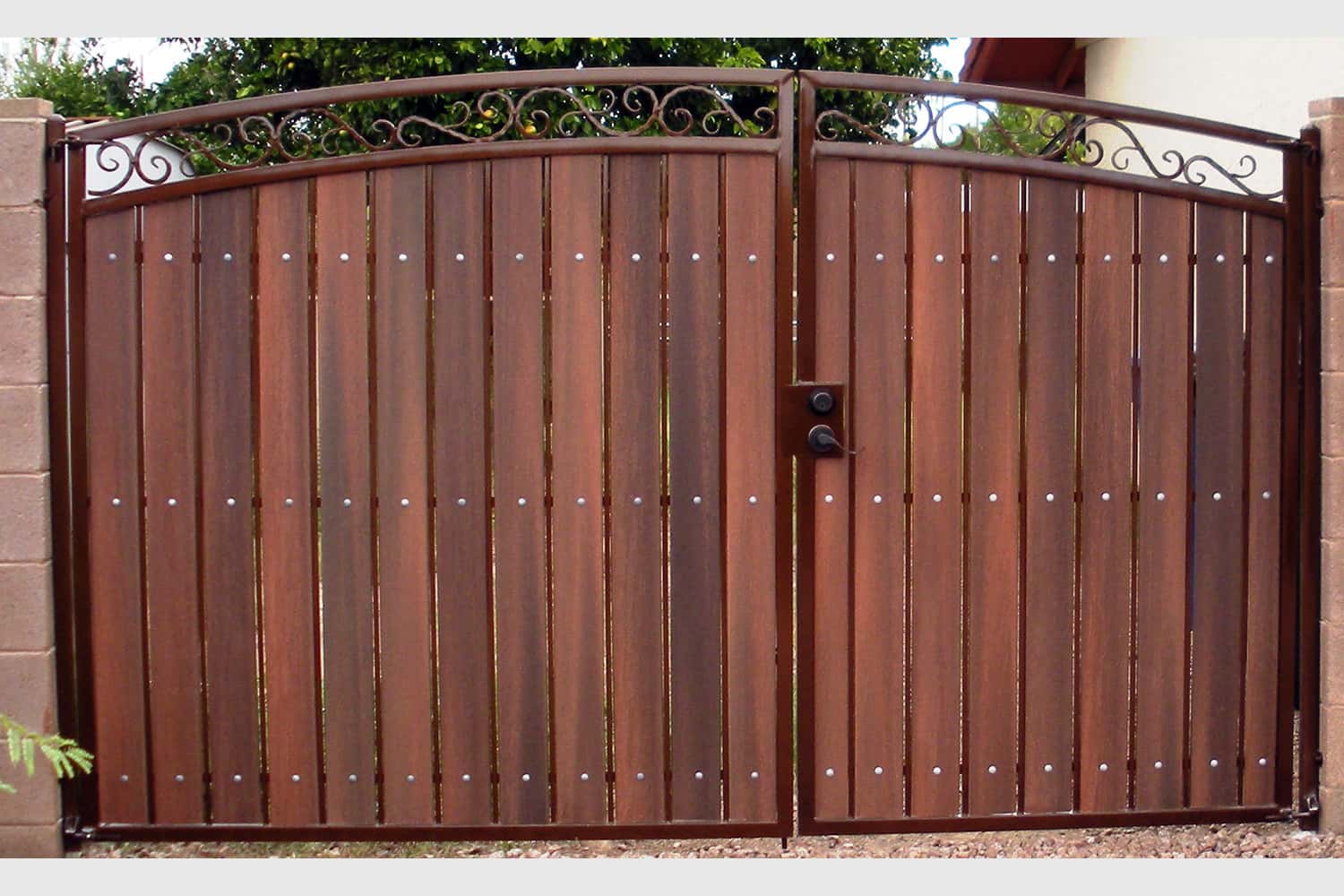 Decorative Arched RV Gate with Rust and Redwood